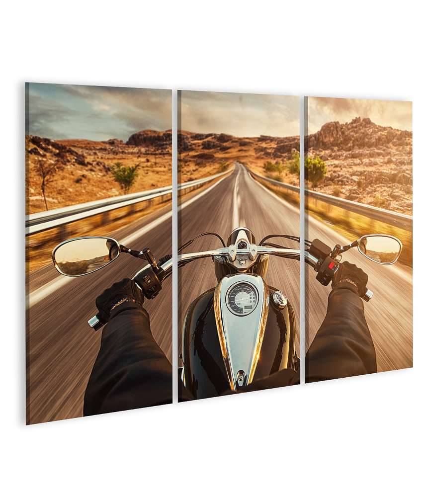 Islandburner Bild auf Leinwand Motorradfahrer allein auf US-Highway, umgeben von atemberaubendem Sonnenuntergang