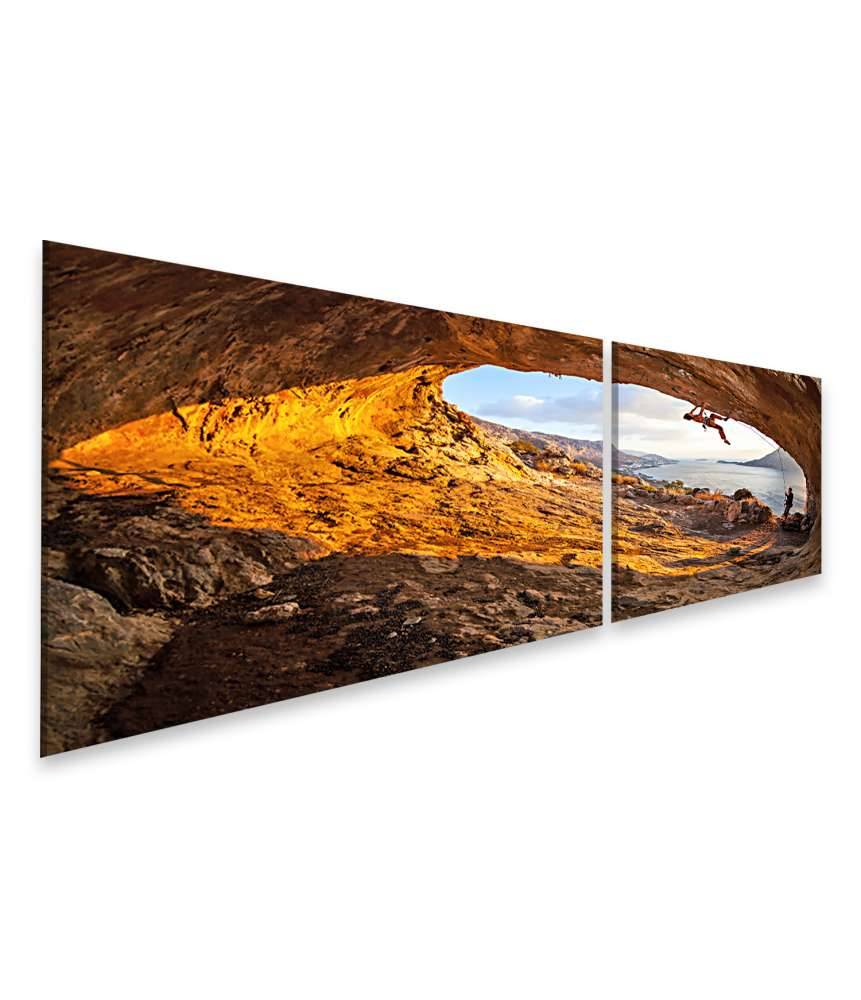 Islandburner Bild auf Leinwand Junge Frau klettert in Höhle mit atemberaubender Aussicht im Hintergrund 2025