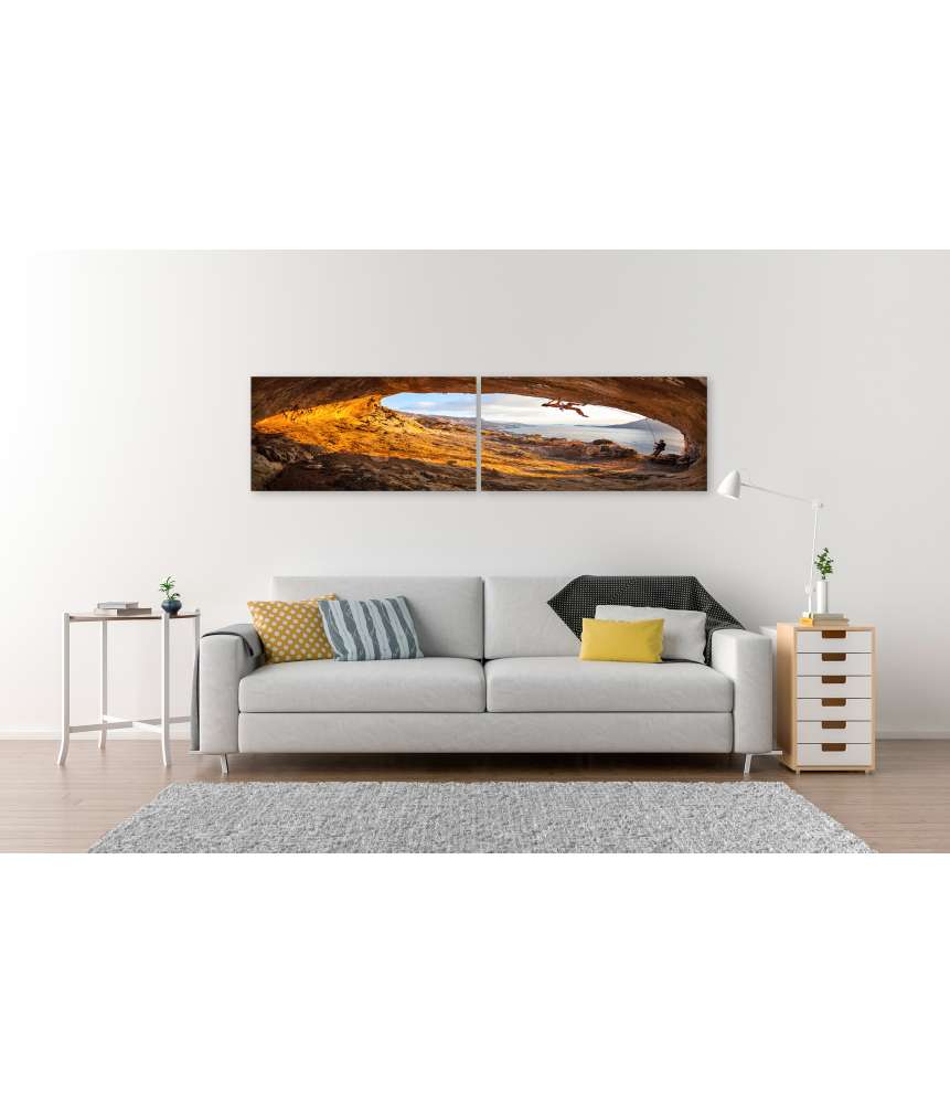 Islandburner Bild auf Leinwand Junge Frau klettert in Höhle mit atemberaubender Aussicht im Hintergrund 2025