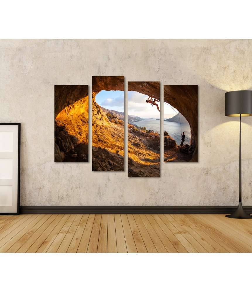 Islandburner Bild auf Leinwand Junge Frau klettert in Höhle mit atemberaubender Aussicht im Hintergrund Rabatte dieses Monats