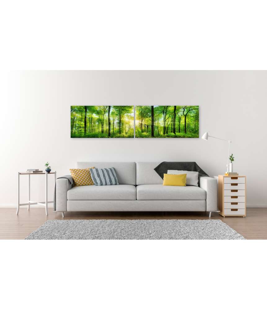 Islandburner Bild auf Leinwand Panoramabild eines frischgrünen Waldes mit Sonnenstrahlen durch Laubbäume Flash Sale