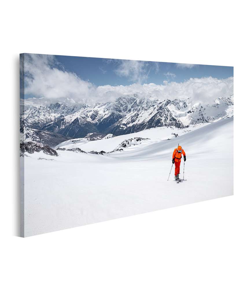 Islandburner Bild auf Leinwand Freerider in gelbem Skianzug und Rucksack in dynamischer Aktion JETZT KAUFEN
